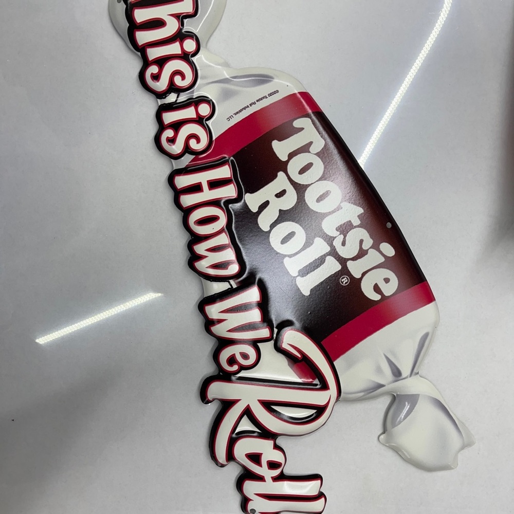 Die cut tootsie roll sign